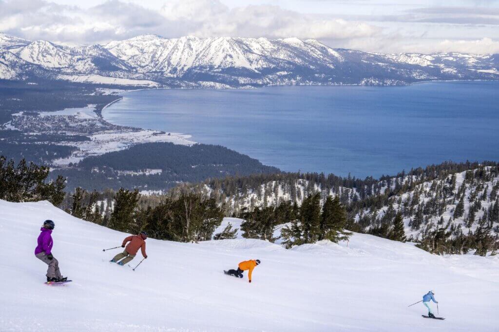 a group of friends skiing down Heavenly Mountain Resort on opening day